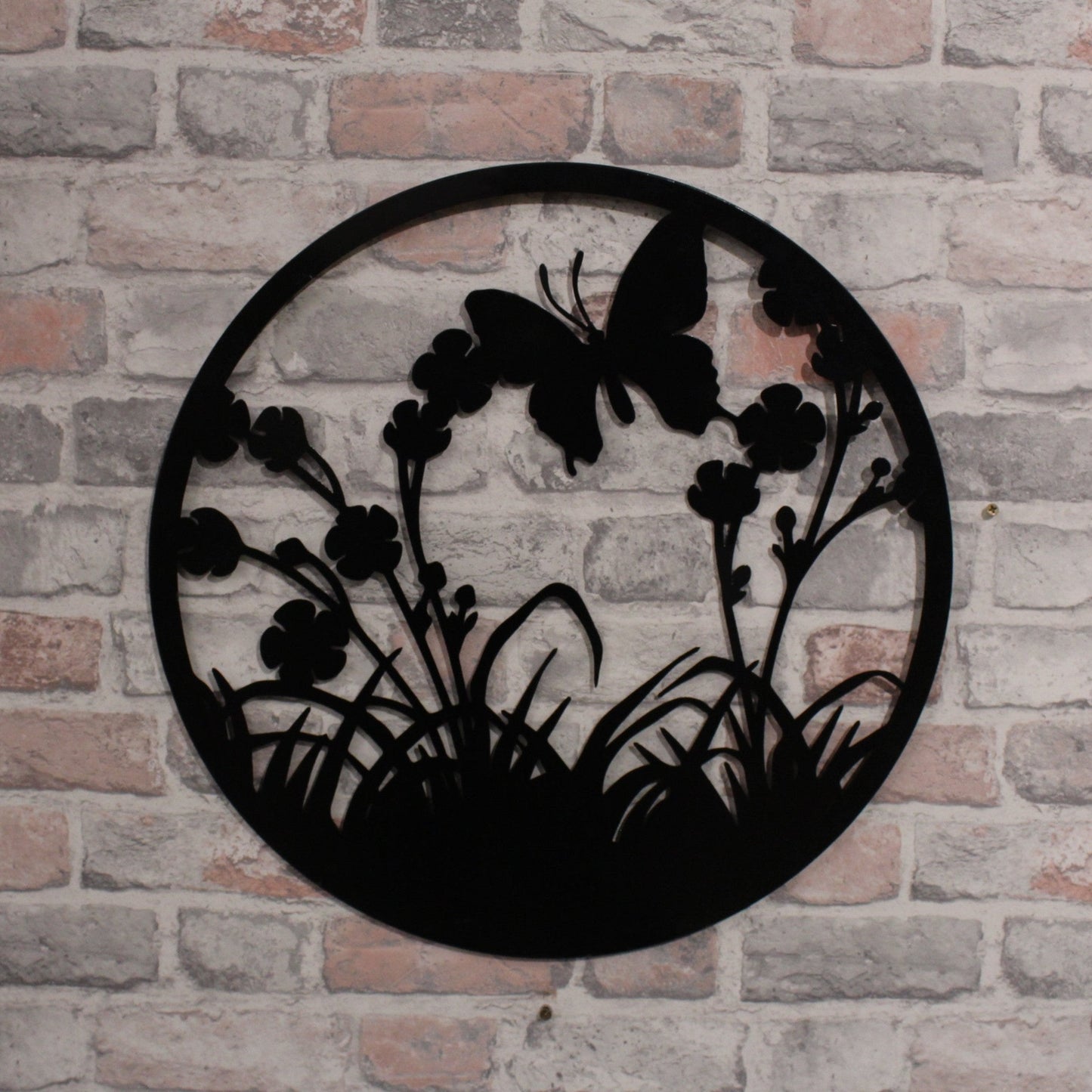 Silhouette de papillon volant rond en métal