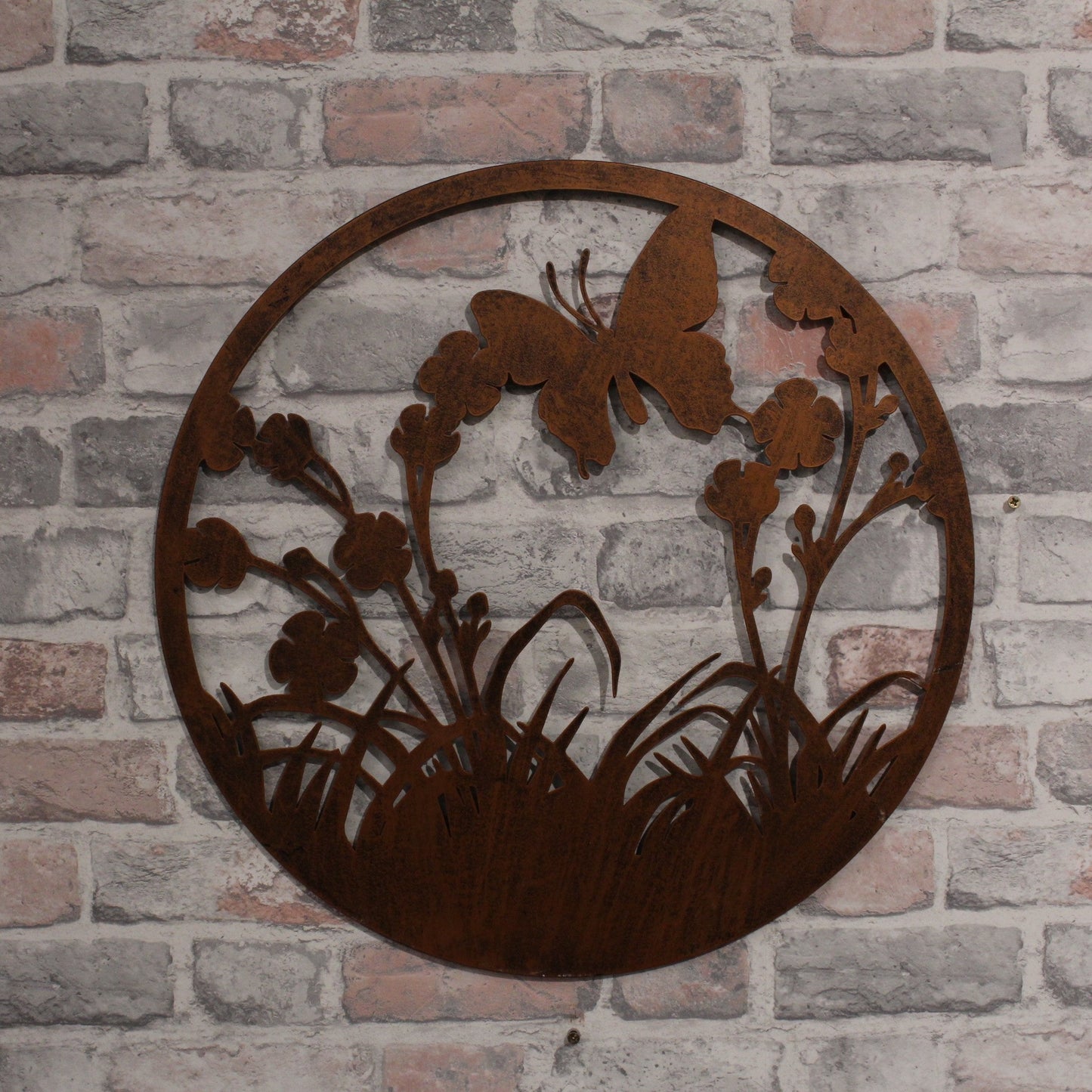 Silhouette de papillon volant rond en métal